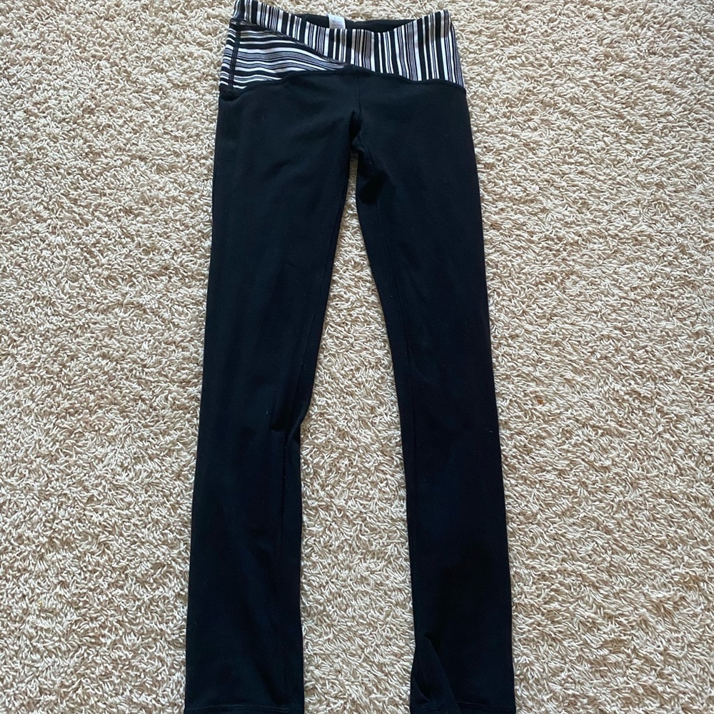 Black Ivivva Leggings with Stripe design on Waist